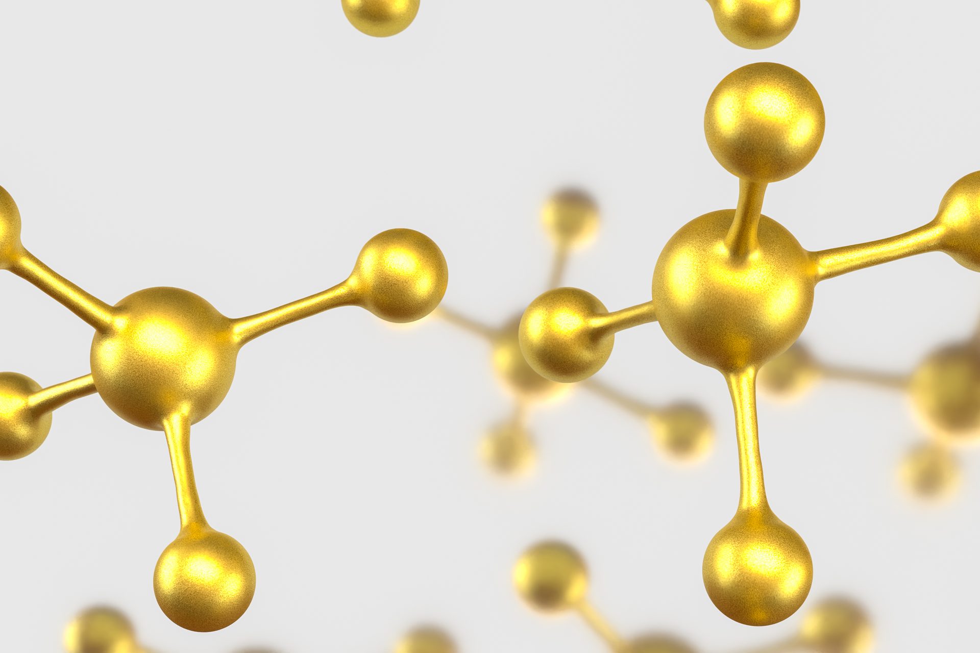 Gold ball-and-stick molecular models floating against a light grey background